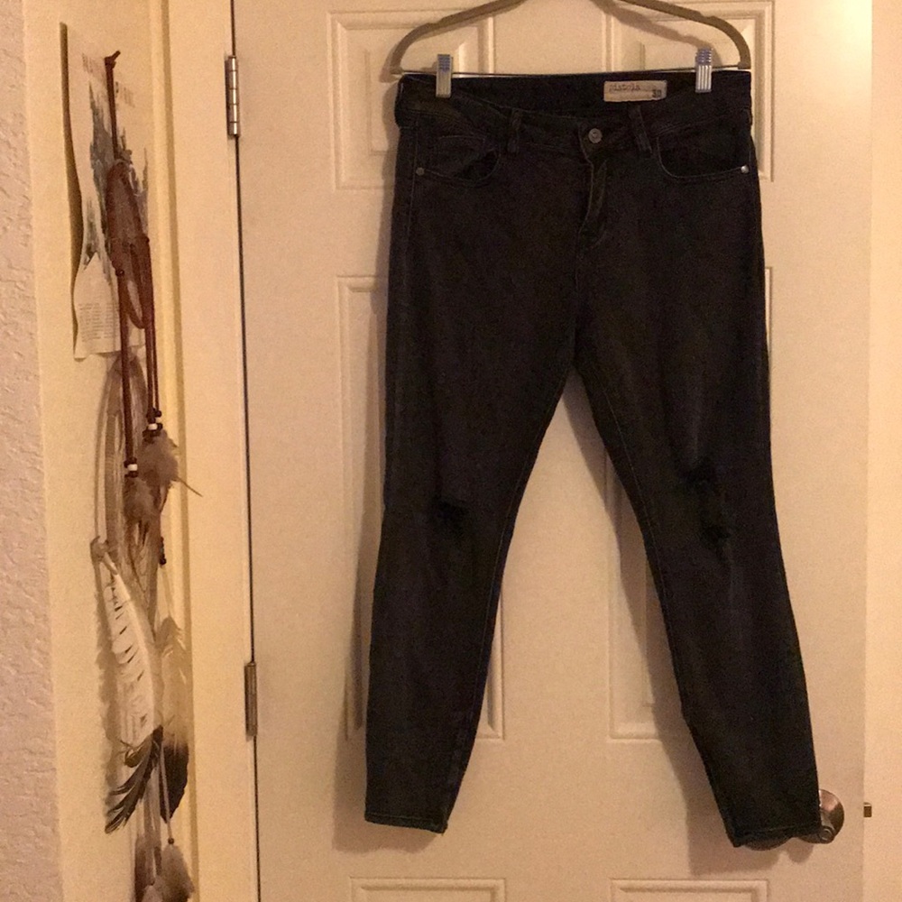 Black distressed pistola skinny jeans